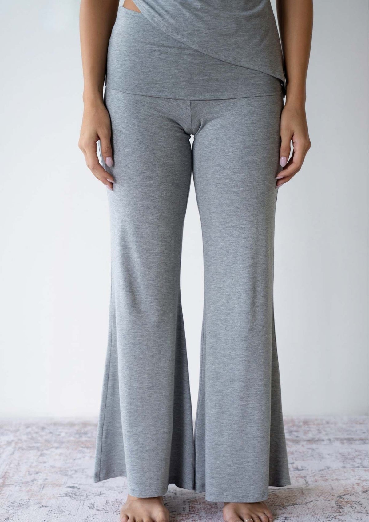 Model wearing the JALA Chill Yoga Pant in Heather Grey, front view