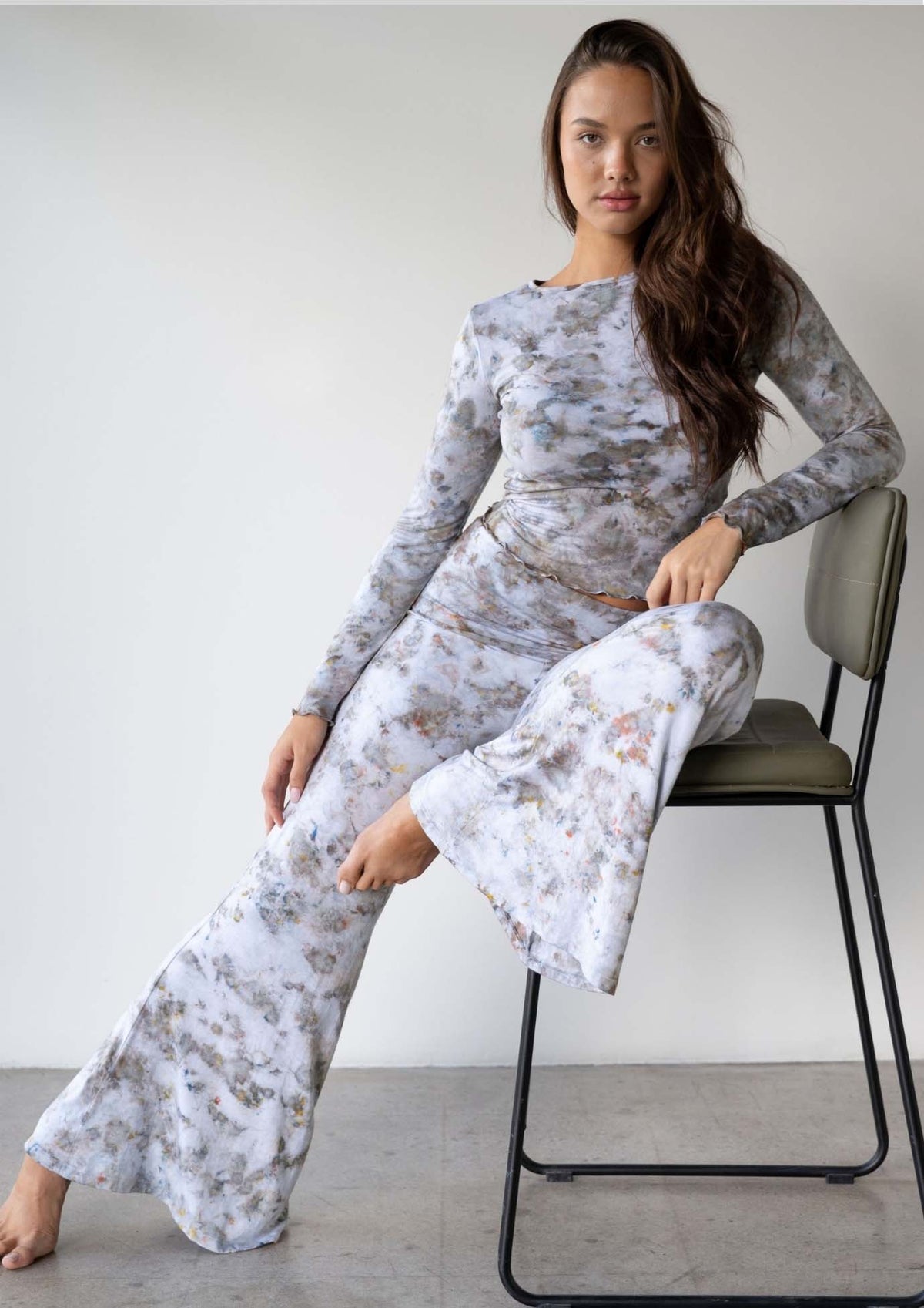 Model wearing the JALA Chill Yoga Pant in Morel with roll down waist and wide leg, lifestyle shot