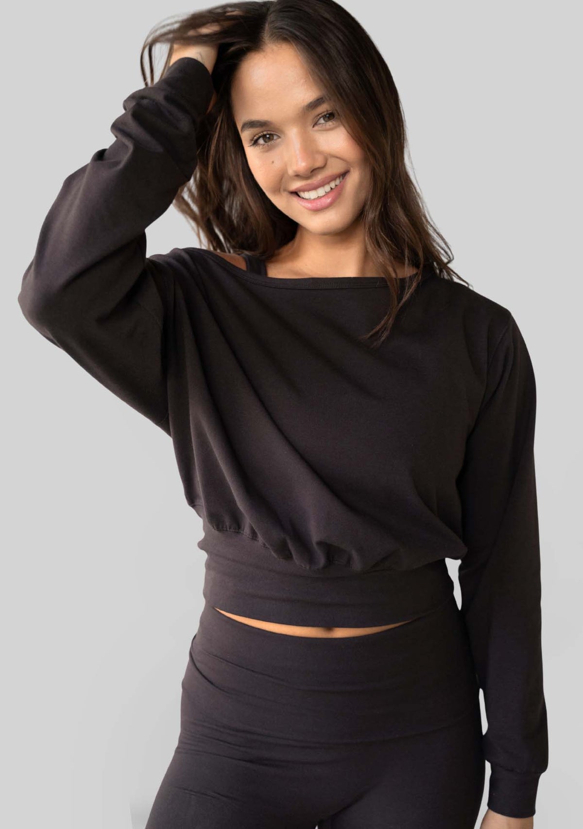 Model wearing the JALA Aela Top in Chocolate, styled front view