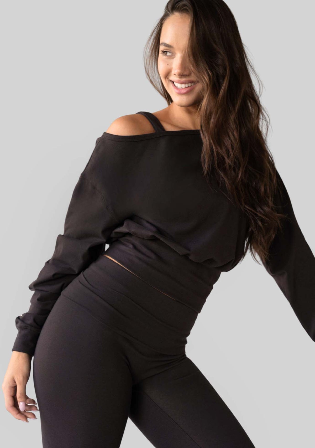 Model wearing the JALA Aela Top in Chocolate, lifestyle shot