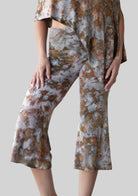 Jala Chill Yoga Capri in Terra - front view. [label] Athena is 5'9" XS