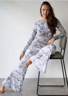 Model wearing the JALA Chill Yoga Pant in Morel with roll down waist and wide leg, lifestyle shot
