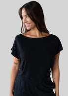 Model wearing the JALA Dreamer Dolman Tee in Black, styled front view