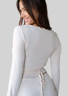 Back view of the JALA Kira Wrap Top in Cream