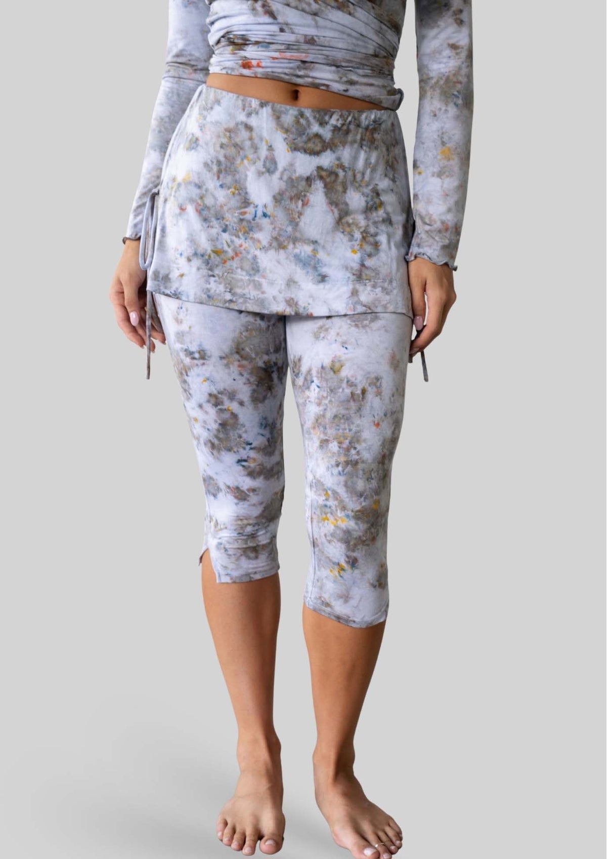 Model wearing the JALA Luna Capri in Morel with skirt overlay and side ties, front view