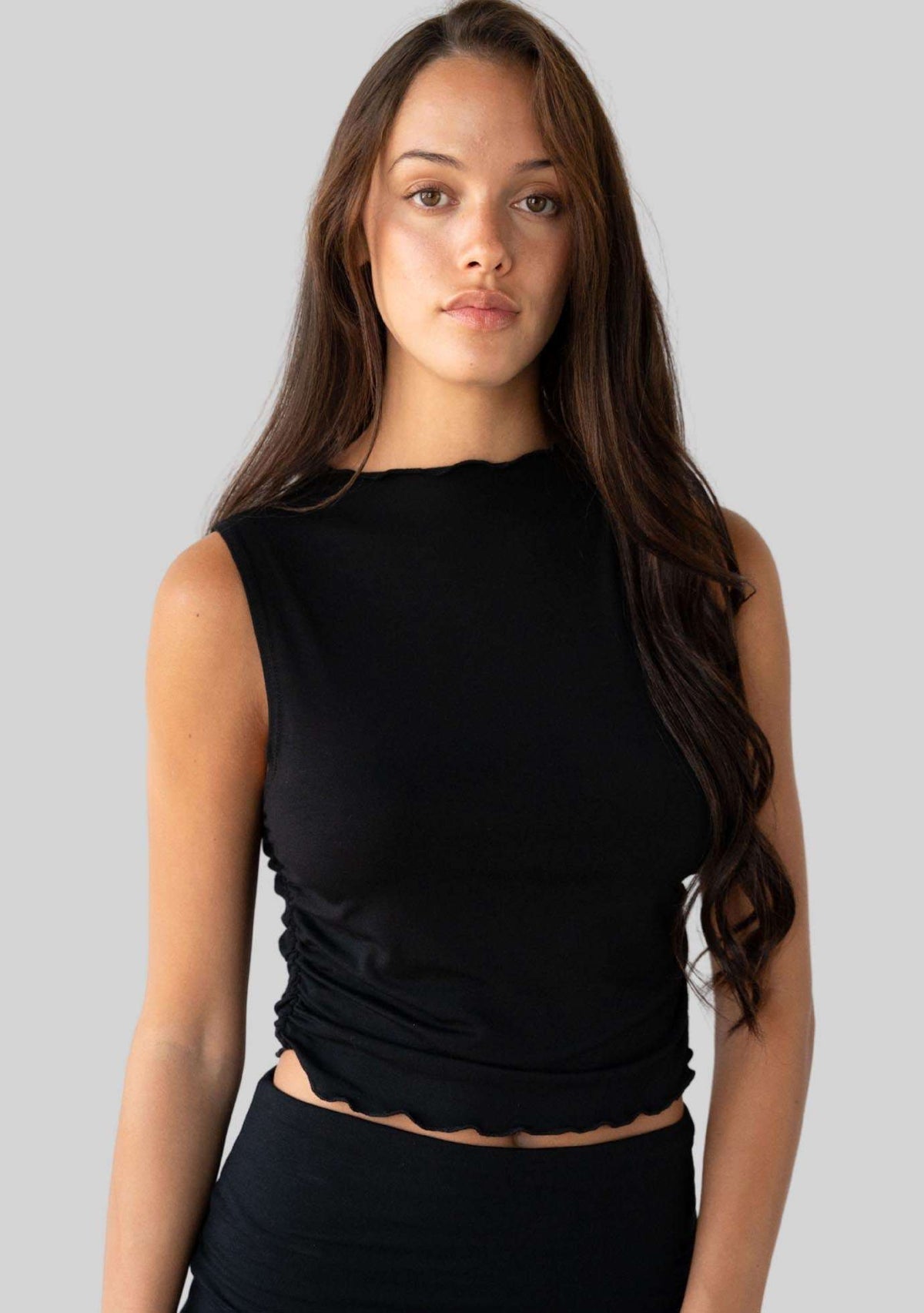 Jala Whisper Tank in Black - model photo. [label] Amelia is 5'9" S